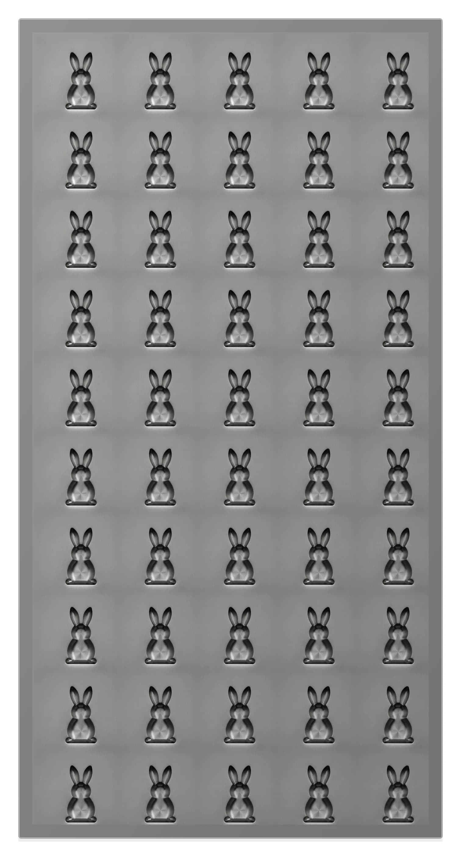 Brushed stainless steel plate with fifty bunny-shaped cavities machined into its face, five across and ten rows down